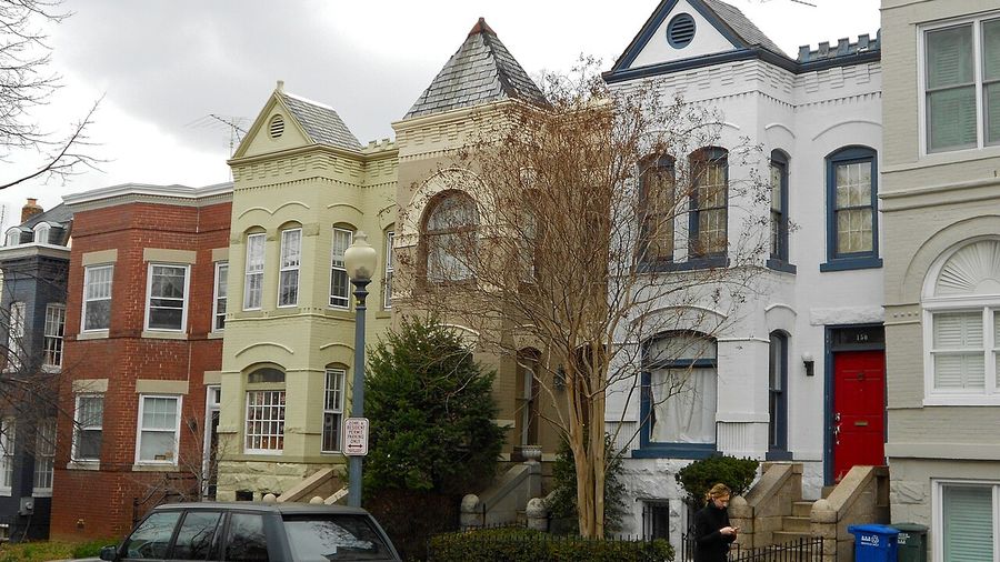 Victorian rowhouses on a tree-lined Capitol Hill street in Washington, DC
