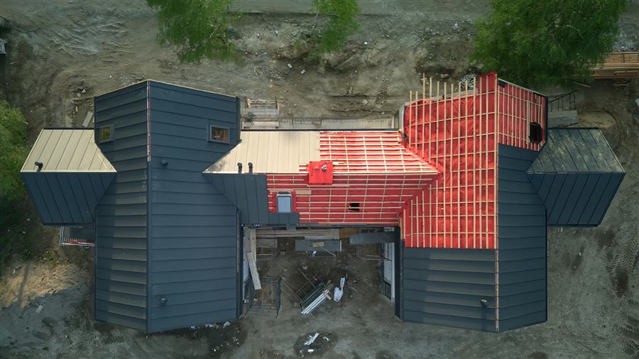 Aerial view of a ground-up new construction investment property mid-build